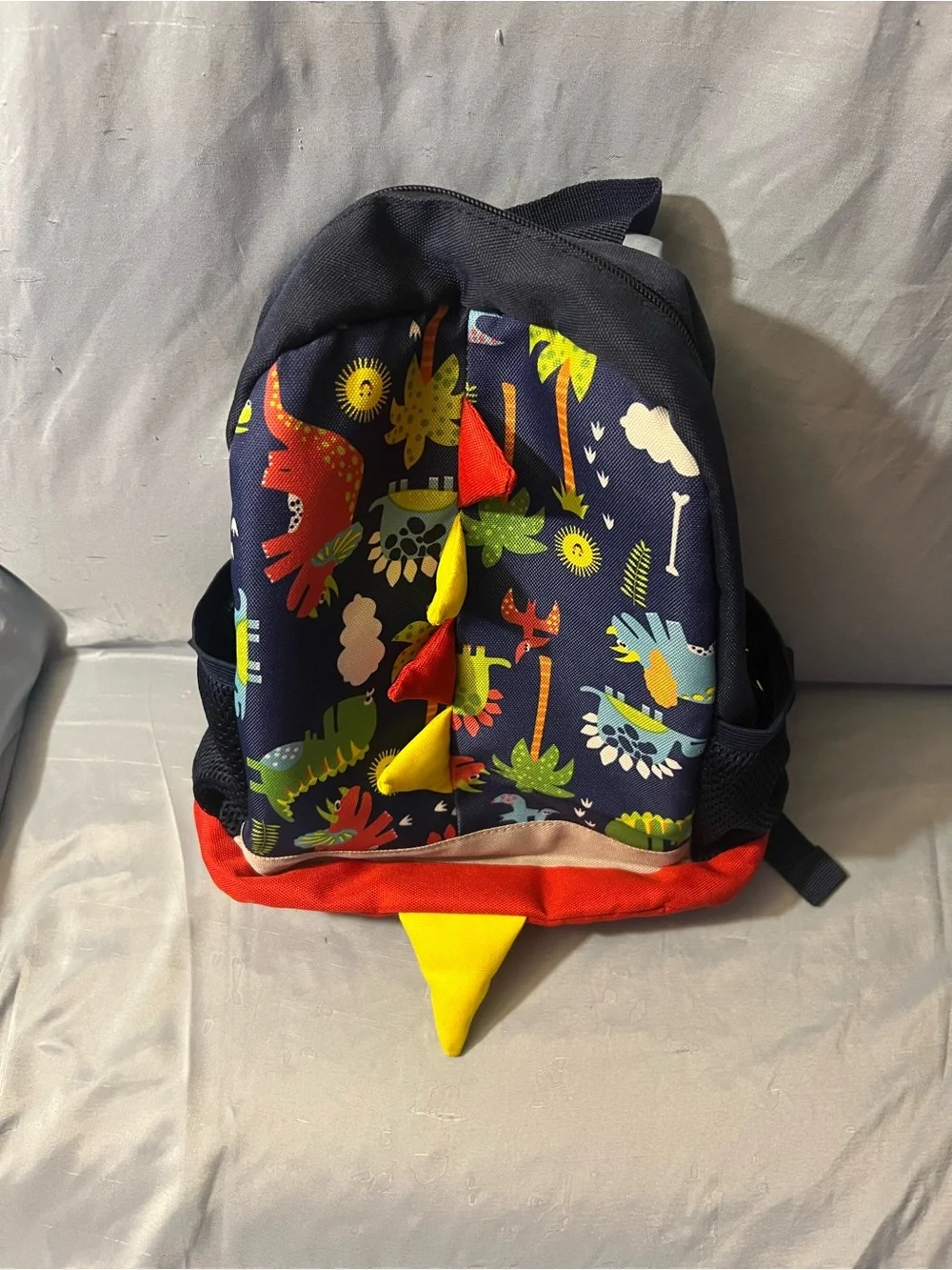 Kids Dinosaur Print Navy Backpack with Red & Yellow Accents